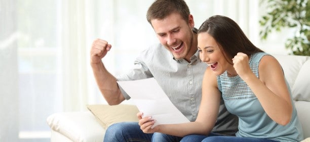 couple happy to have received a pre-approved credit card offer
